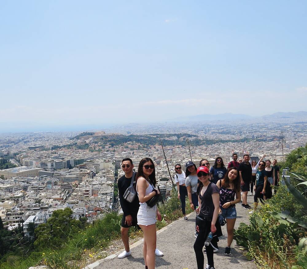 Group of students on a hike that overlooks Athens