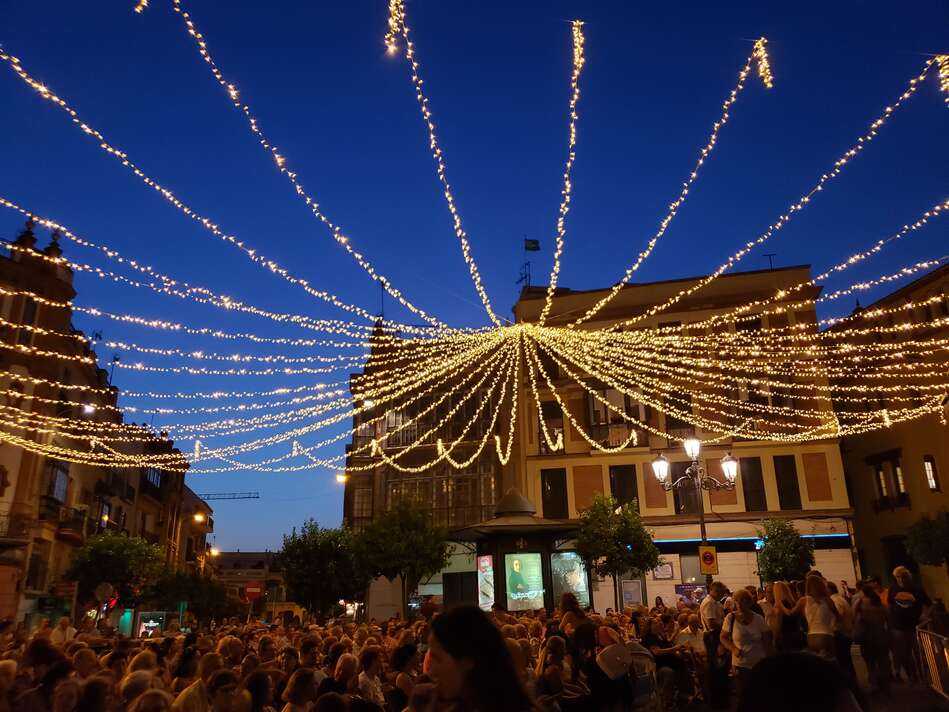 Festival night shot with string of lights above