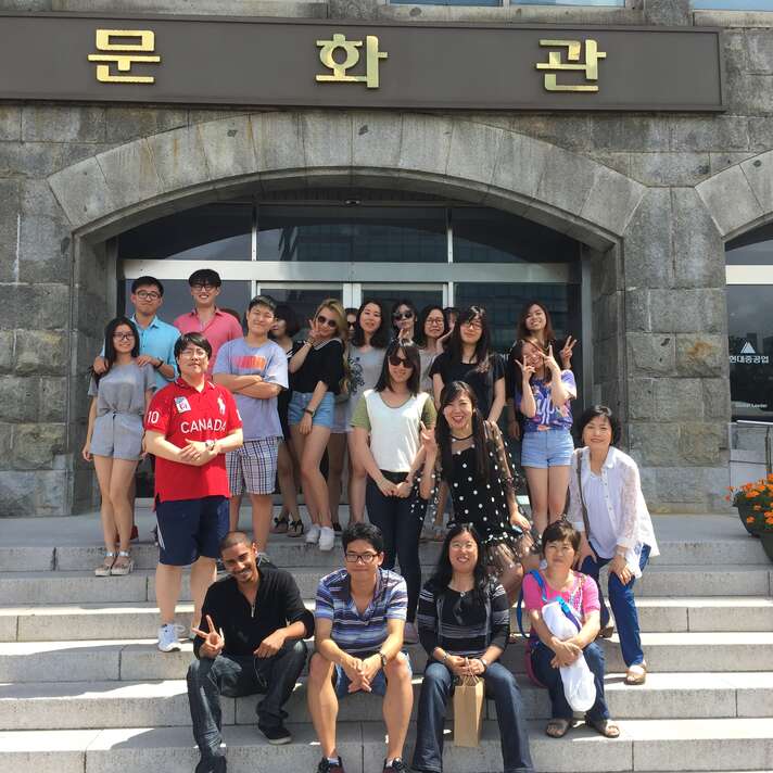 Group of students in front of the Hyundai Heavy Industries building