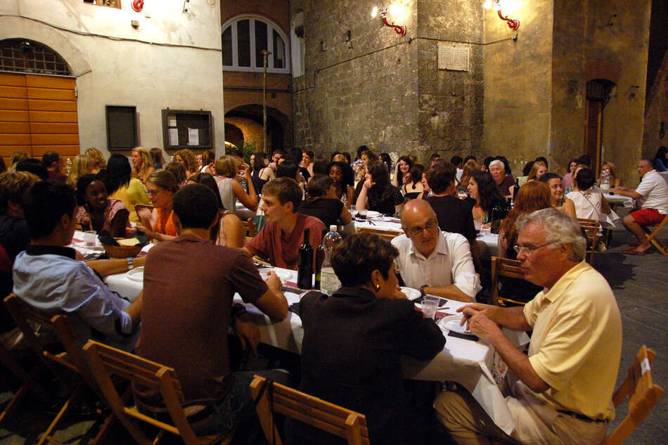 Group of people at contrada dinner.