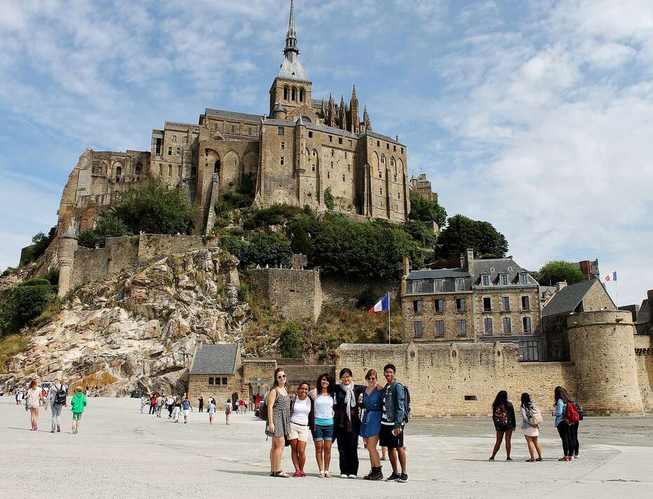 Five students in front of castle, Tours, France