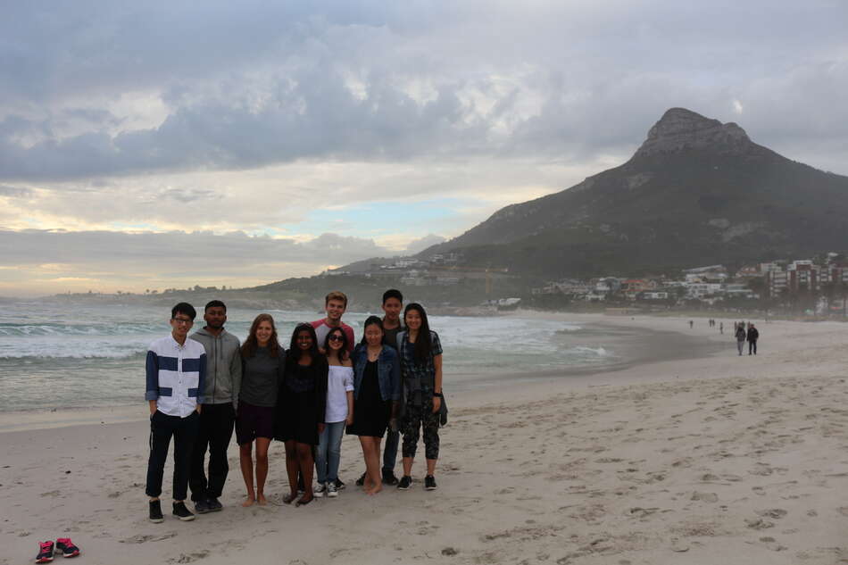 Group of students on beach at Camps Bay.