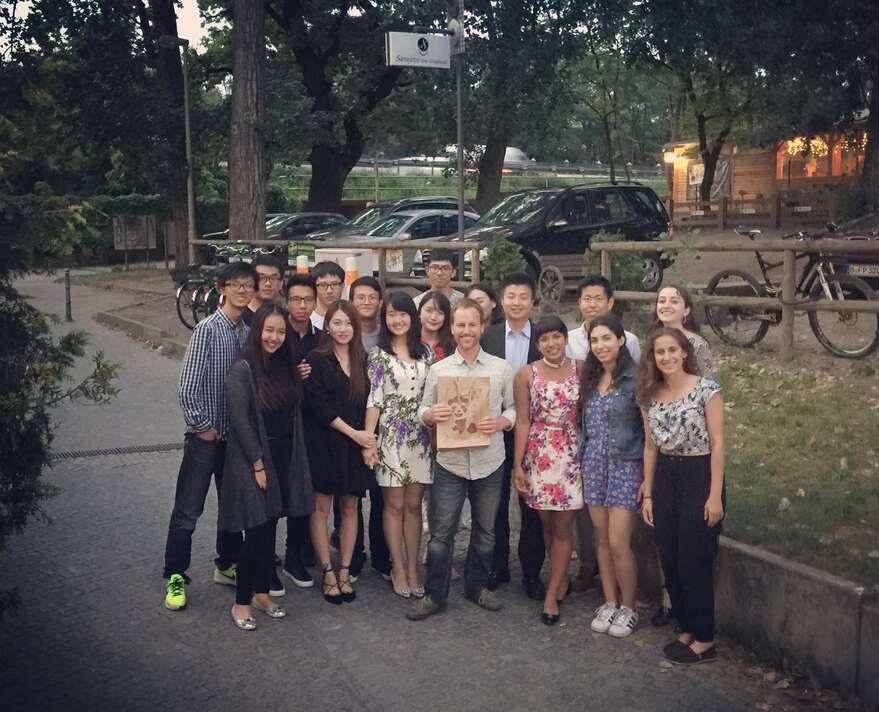 Group of students and professor on street