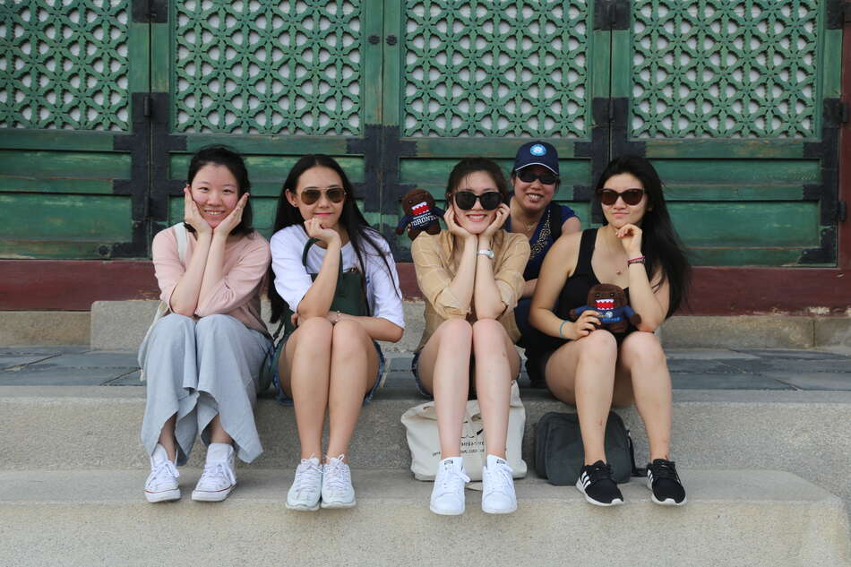 Four students and professor at Chandeok Palace