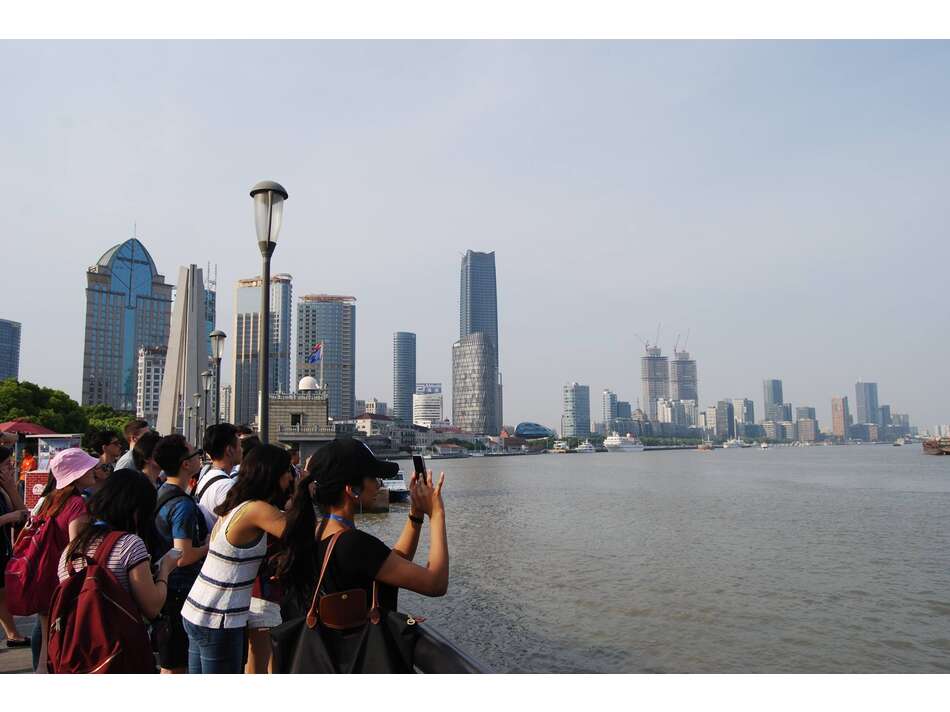 Students taking picture at the Bund, Shanghai