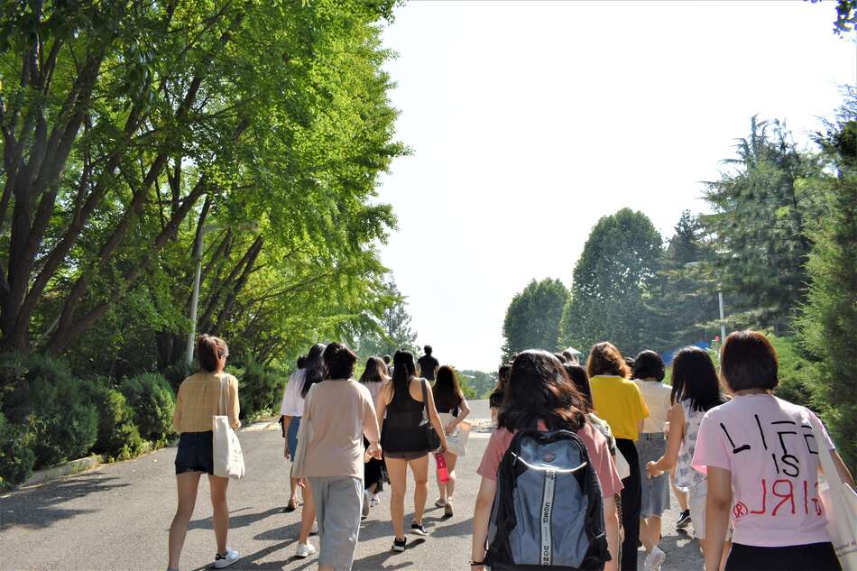 Group of students walking to bus