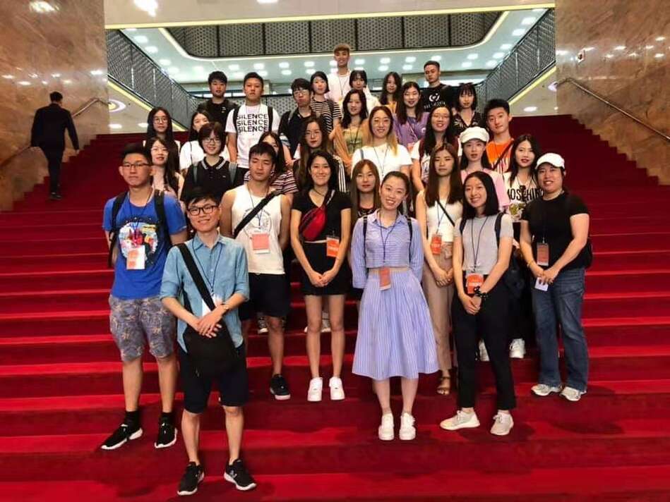 Group of students standing on stairs