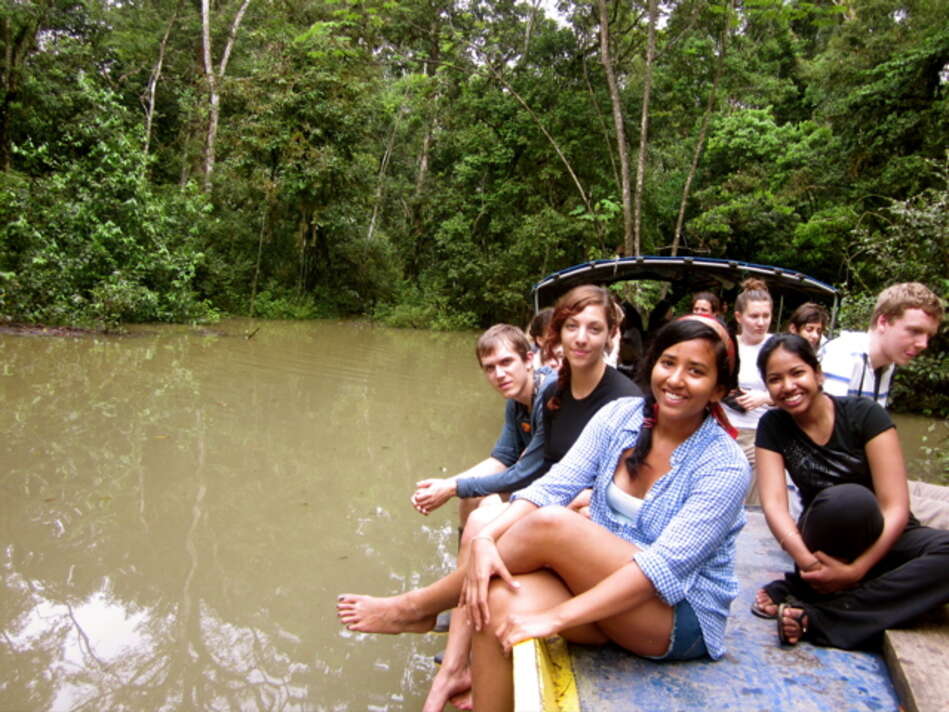 Group of students in a boat on the Tiputini River.