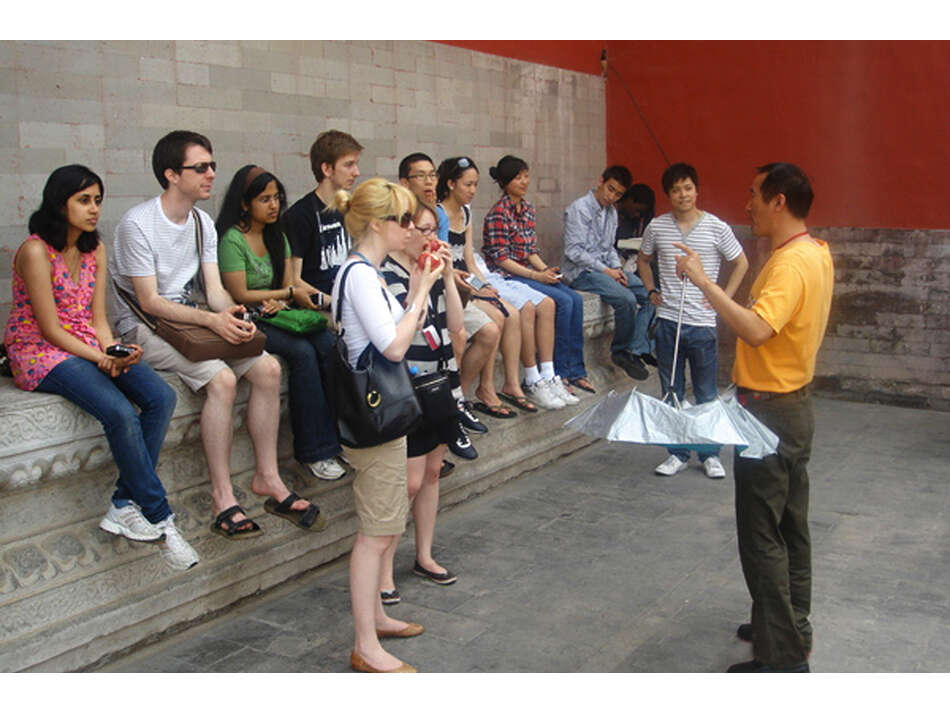 Group listening to tour guide at Forbidden City, Beijing