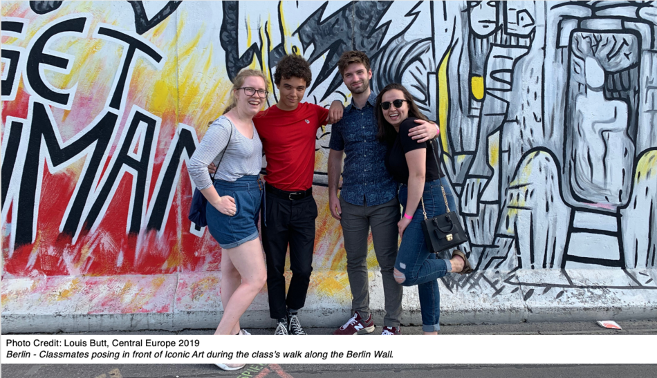Berlin - Classmates posing in front of Iconic Art during the class's walk along the Berlin Wall.