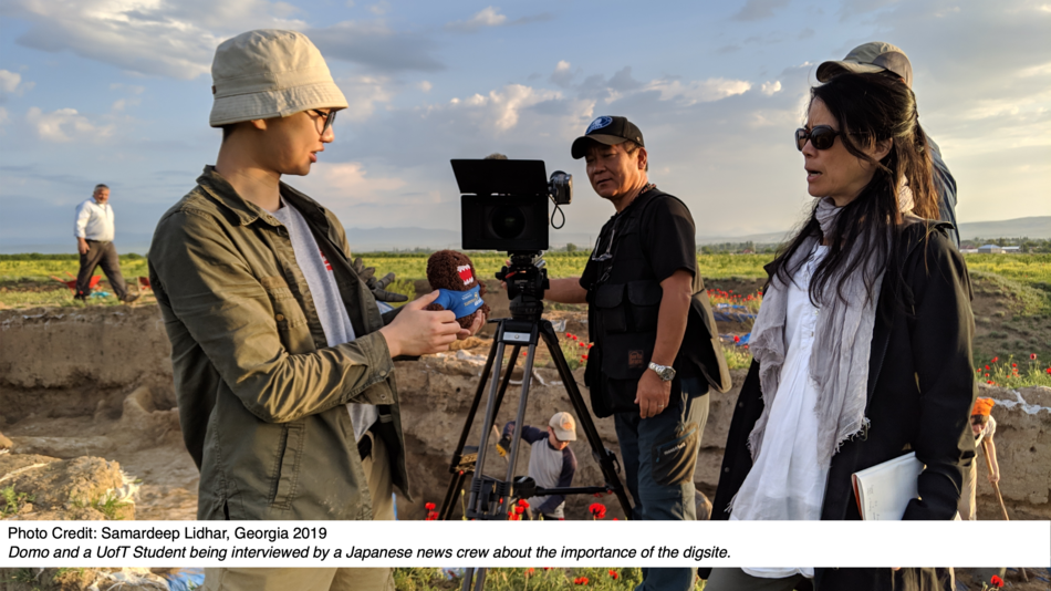 Domo and a UofT Student being interviewed by a Japanese news crew about the importance of the digsite.