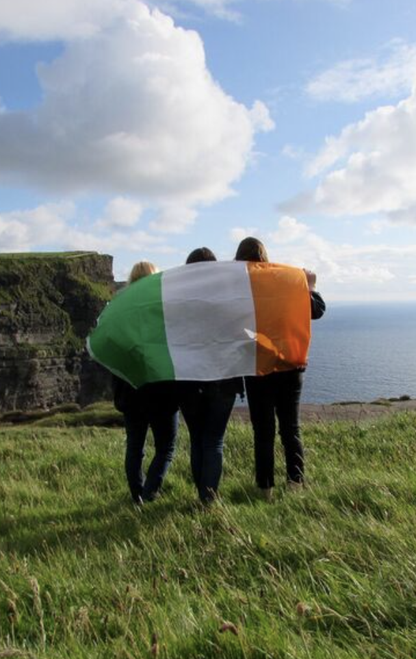 Three students with Irish flag
