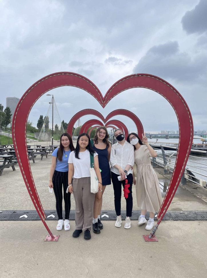 Group of students in front of heart shaped sculpture