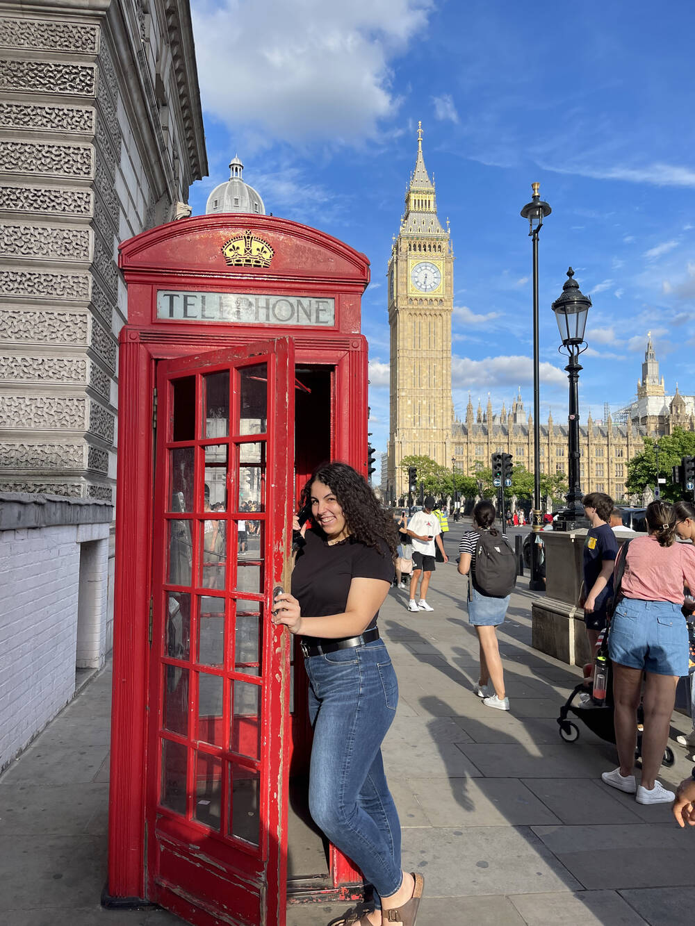Alissia in a telephone booth in front of Big Ben